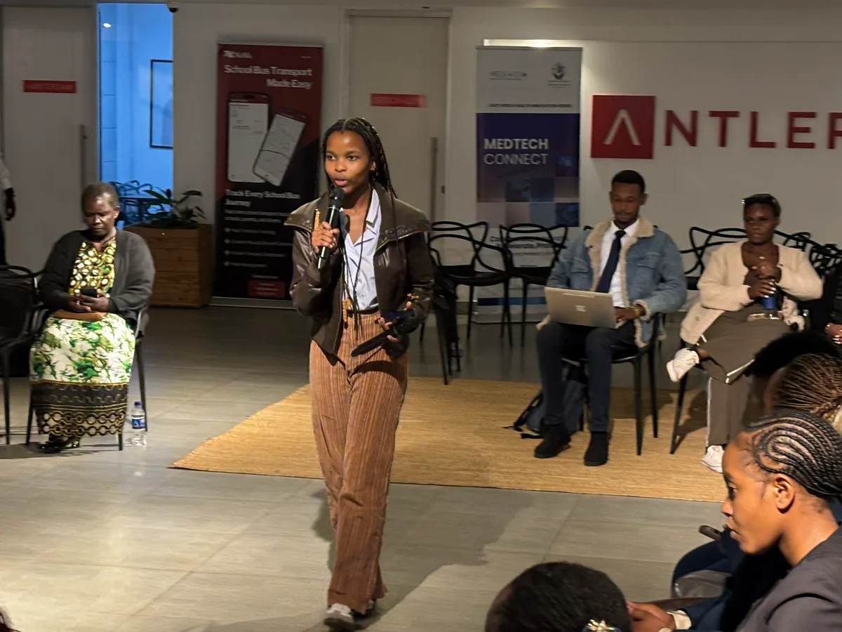 A participant standing to share her own story with the room
